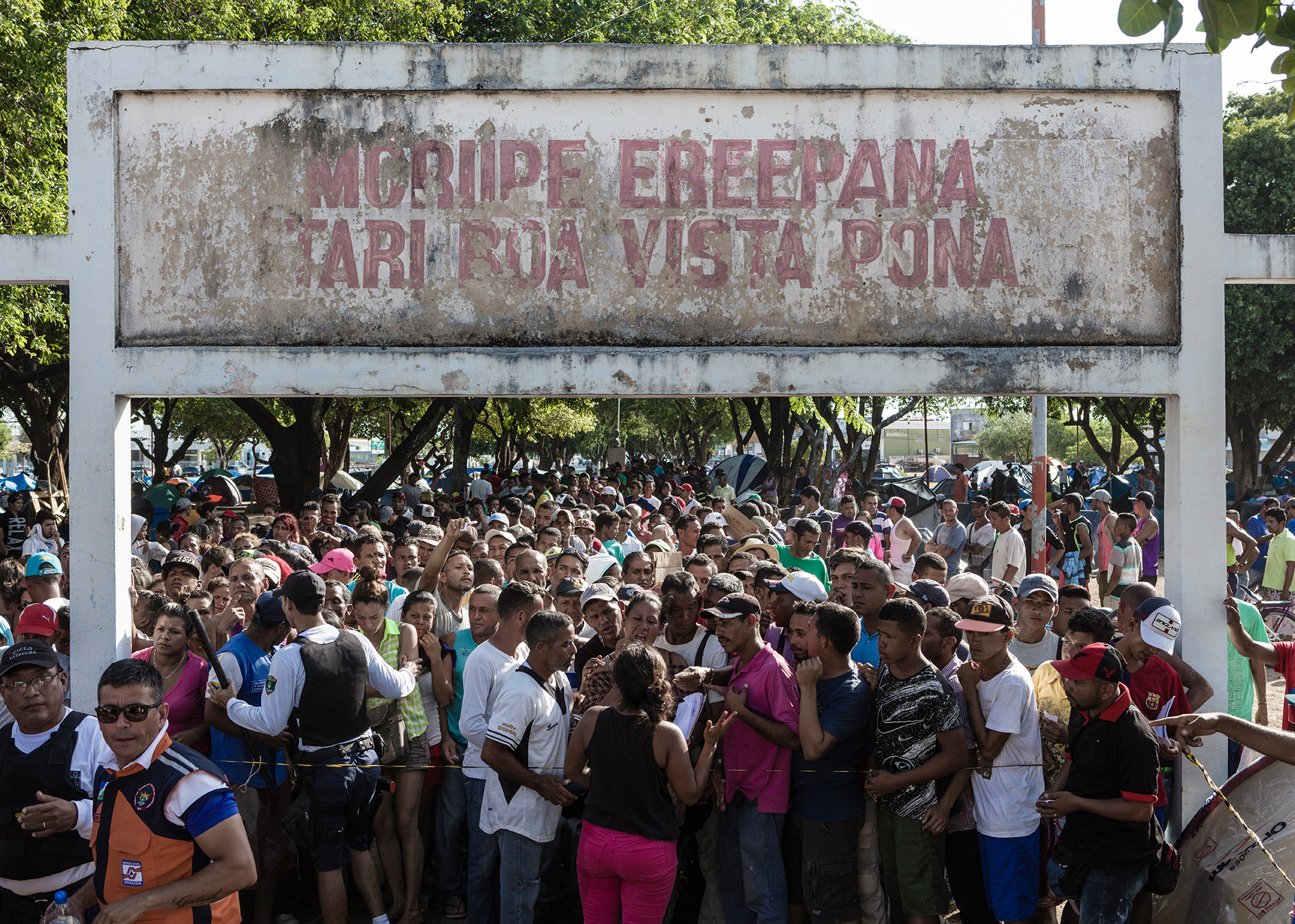 A line of immigrants waiting for donations at Simon Bolivar square, 2018.