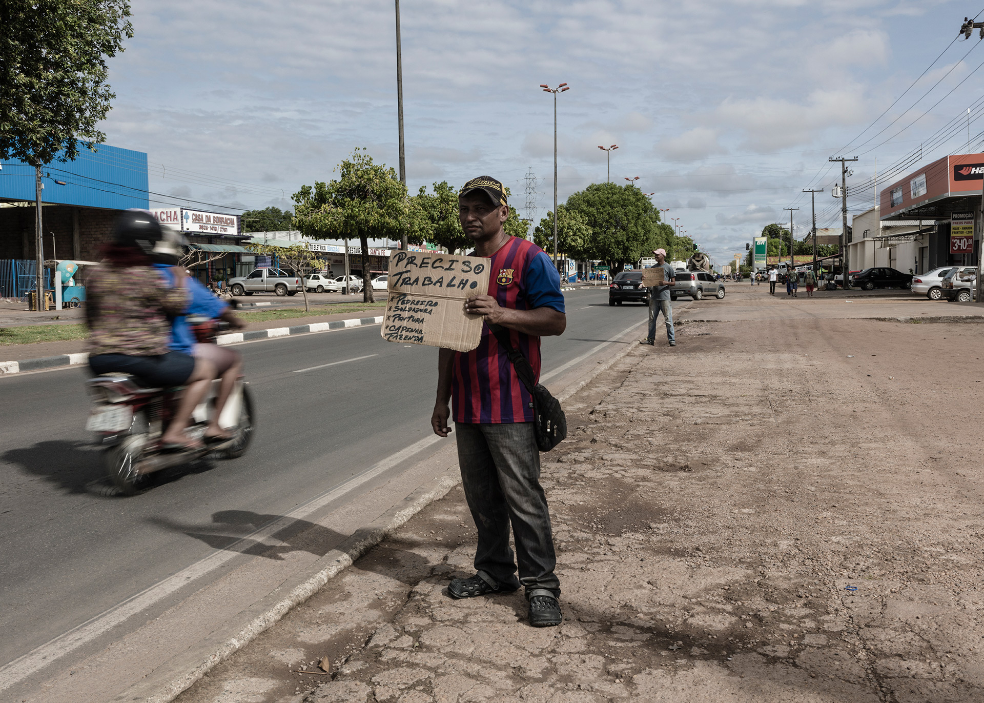 Dozens of Venezuela immigrants hold adds offering their services in the streets of Boa Vista, 2018.