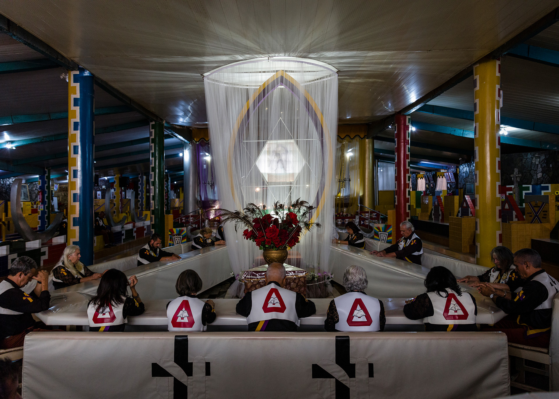 A group of religious praying inside the main temple.