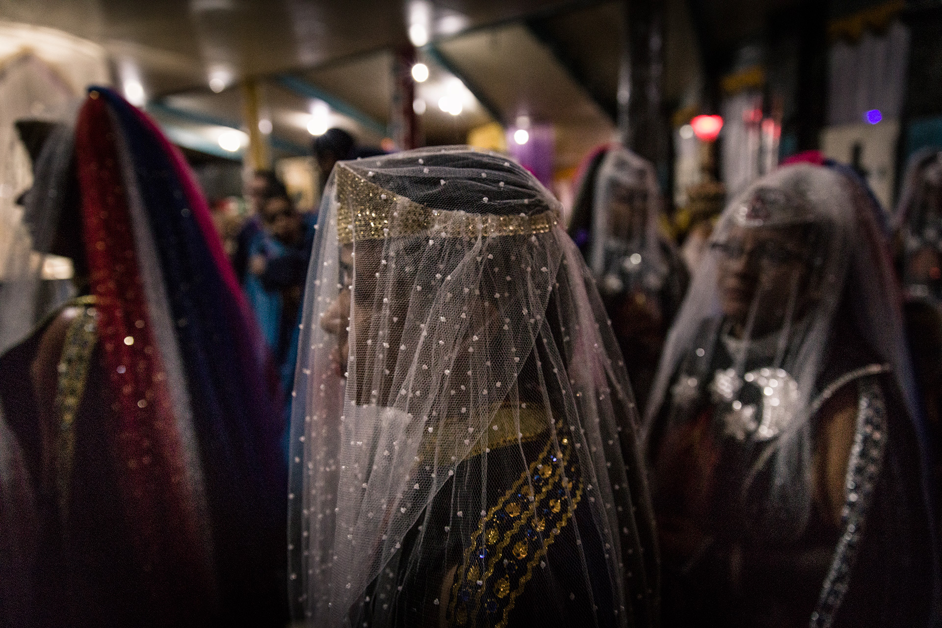 Woman in special outfits during the rituals.