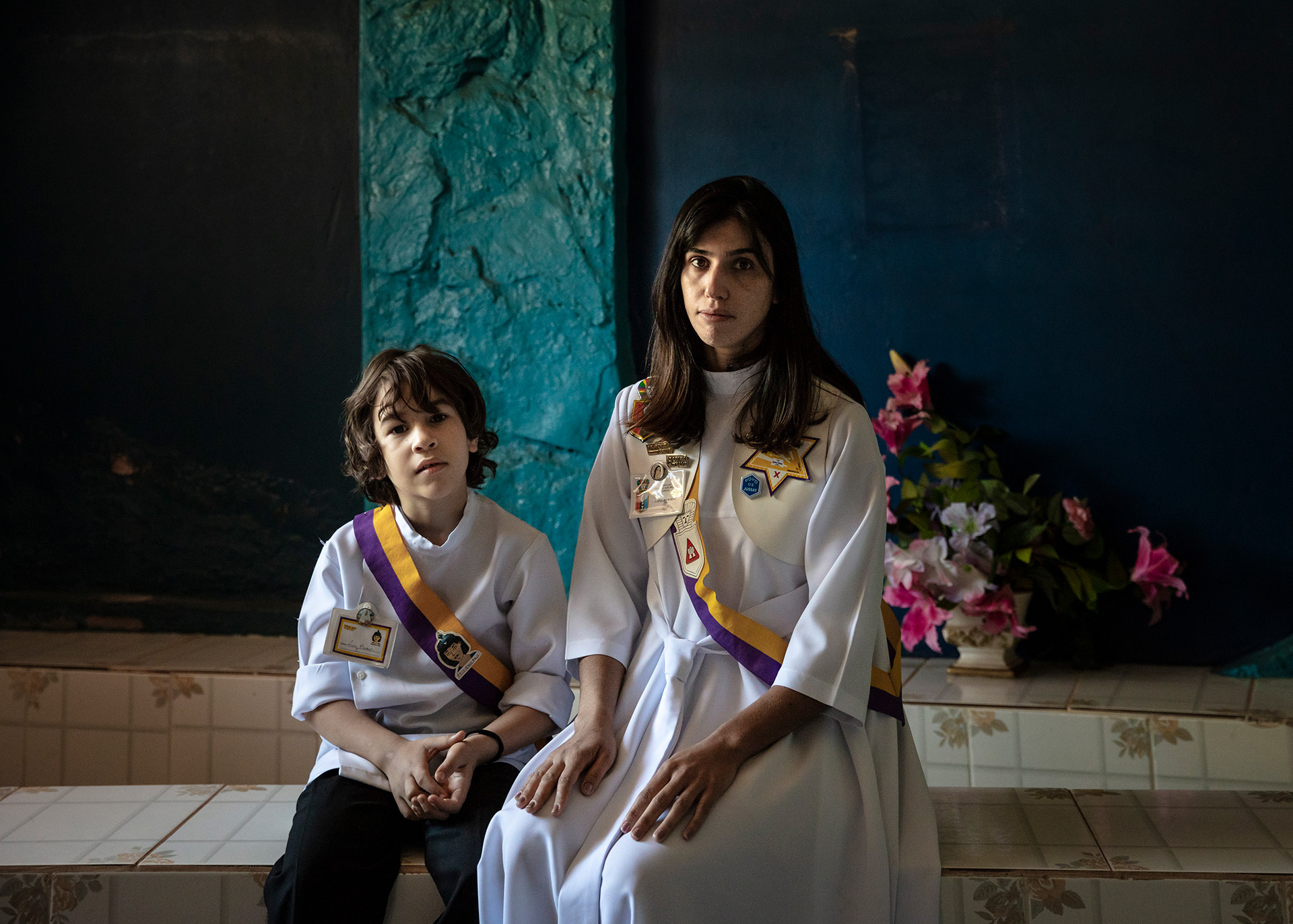 A young woman and her son in a praying room.